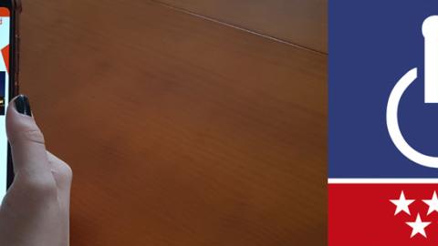 Banner de la App "Tarjeta de discapacidad" de la Comunidad de Madrid Pantalla de inicio de la App "Tarjeta de discapacidad" en un móvil que sujeta una mano.